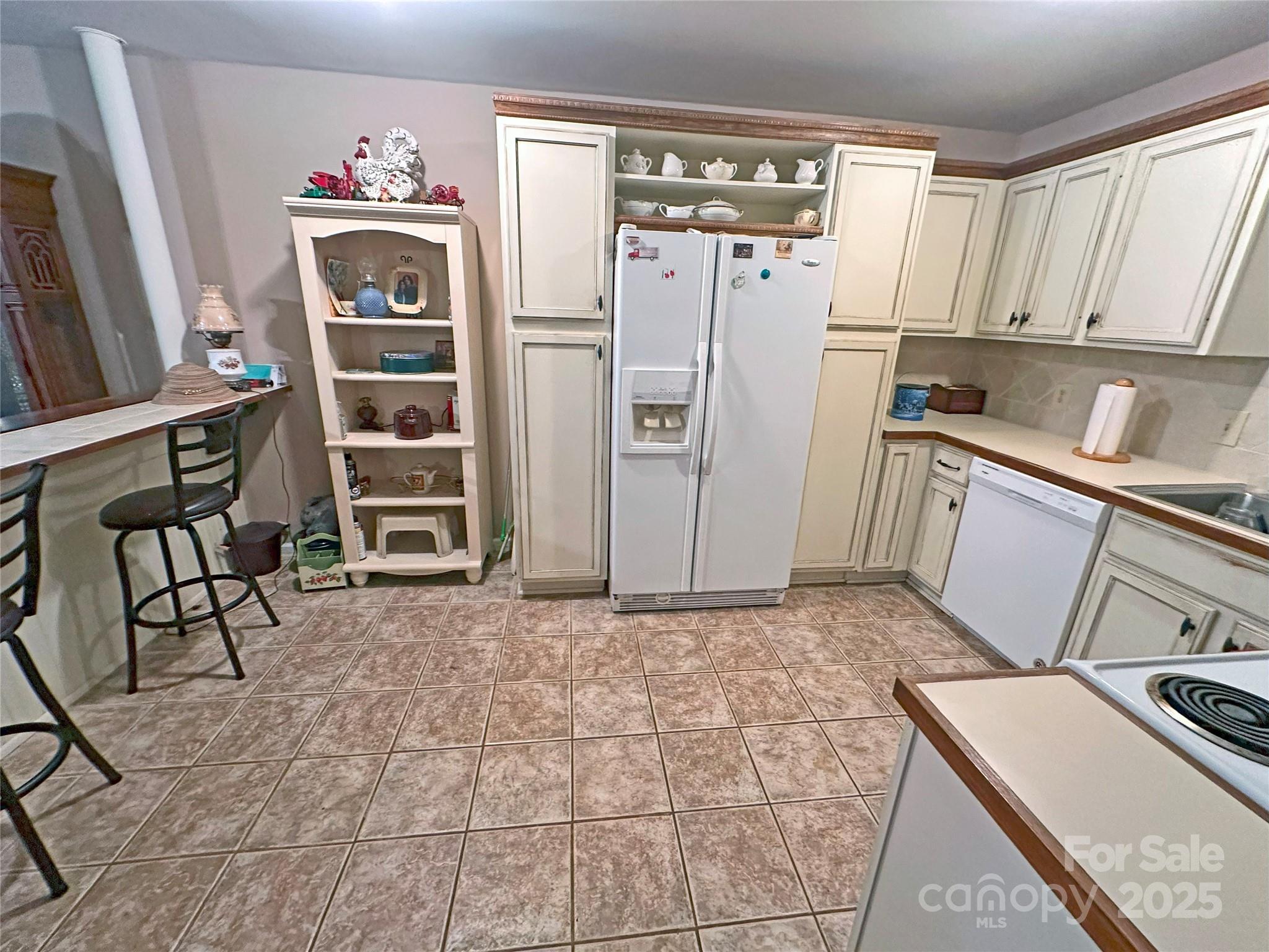 3603 Ritchie Road Lincolnton, NC 28092 - Photo 5 of 44 a kitchen with stainless steel appliances a refrigerator sink and cabinets