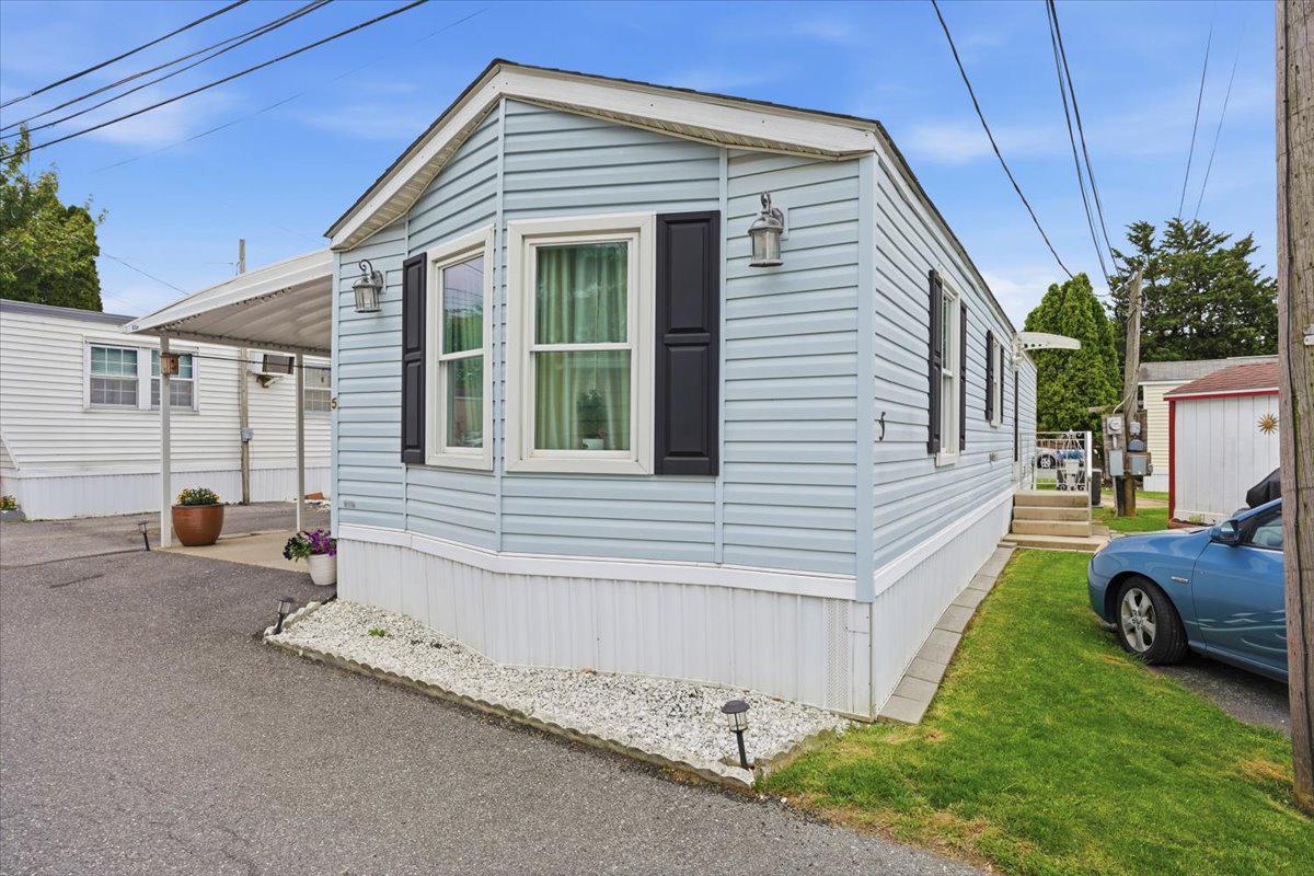 3350 Airport Road, Unit 5 Allentown, PA 18109 - Photo 34 of 53 Charming blue home with inviting curb appeal.