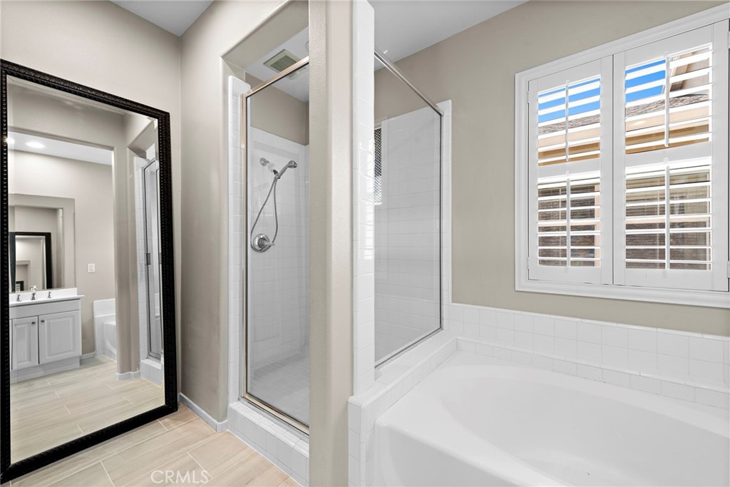 41 Passaflora Lane Ladera Ranch, CA 92694 - Photo 11 of 36 a bathroom with a bathtub and a shower