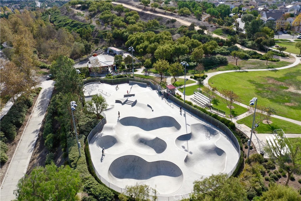 41 Passaflora Lane Ladera Ranch, CA 92694 - Photo 31 of 36 a view of a swimming pool with a yard
