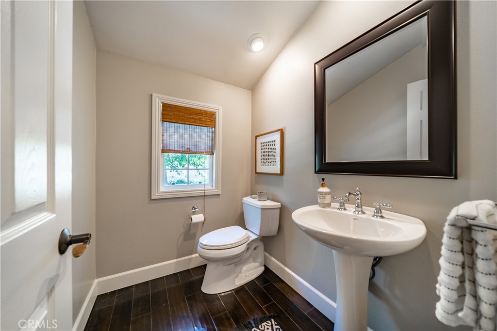 41 Passaflora Lane Ladera Ranch, CA 92694 - Photo 4 of 36 a bathroom with a toilet sink and mirror
