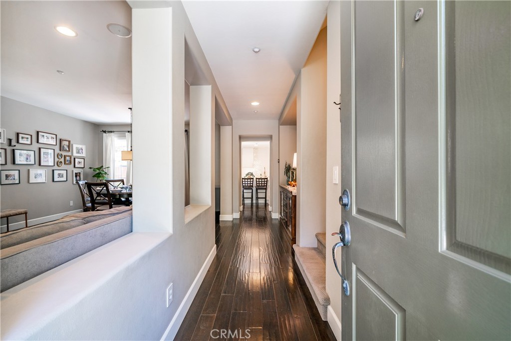 41 Passaflora Lane Ladera Ranch, CA 92694 - Photo 5 of 36 a view of a hallway with wooden floor and furniture