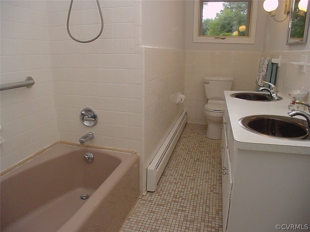 8420 Larkspur Road North Chesterfield, VA 23235 - Photo 29 of 47 Hall bath has ceramic tile tub surround and grab b