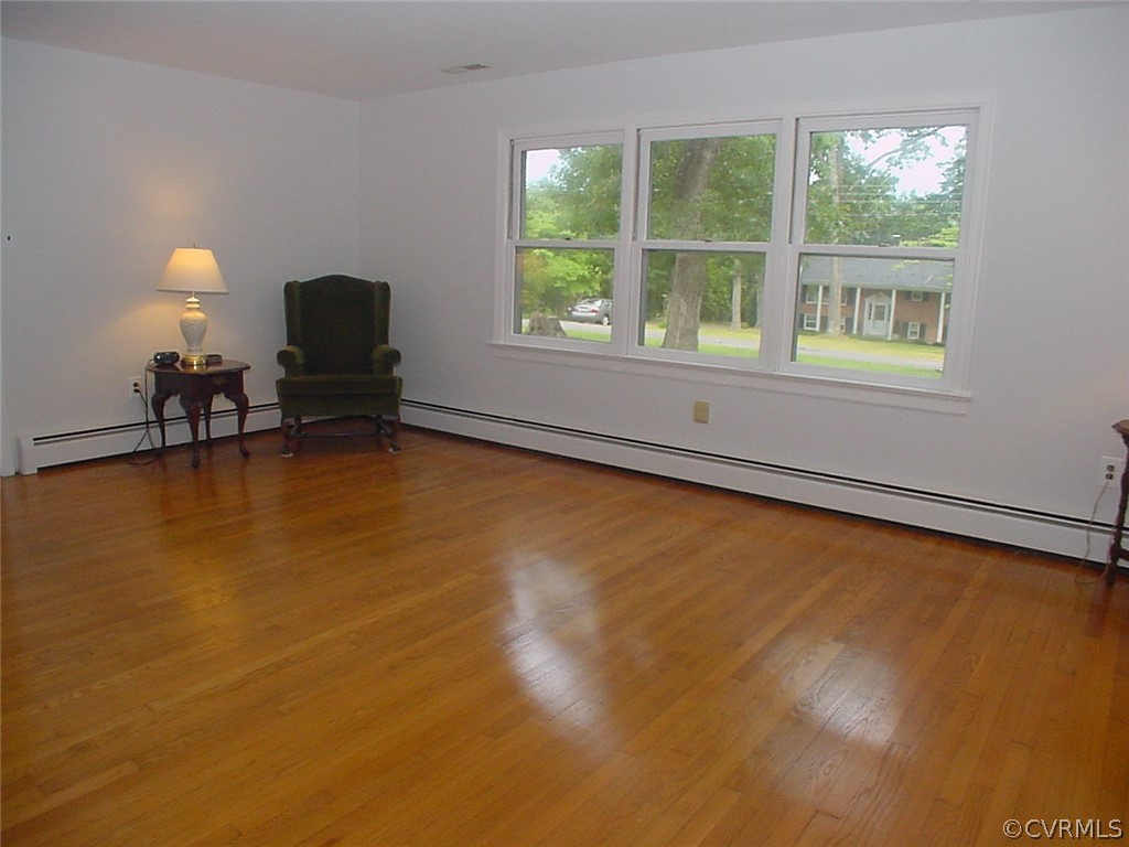 8420 Larkspur Road North Chesterfield, VA 23235 - Photo 4 of 47 Sunny living room has triple windows