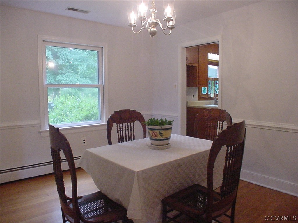 8420 Larkspur Road North Chesterfield, VA 23235 - Photo 6 of 47 Dining room has oak floor & pocket door to kitchen