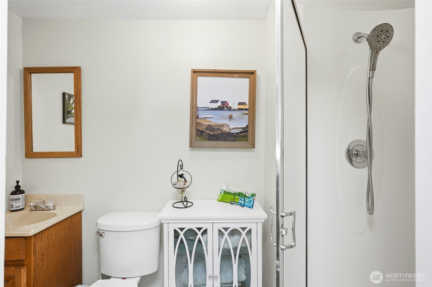 5334 Tenneson Road Sedro-Woolley, WA 98284 - Photo 23 of 39 a bathroom with a sink a toilet and mirror