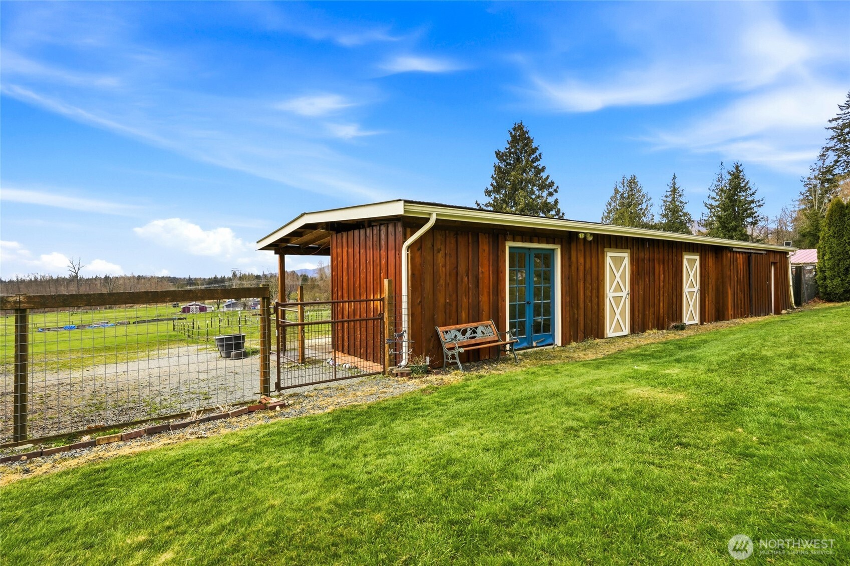 5334 Tenneson Road Sedro-Woolley, WA 98284 - Photo 32 of 39 a view of a backyard with a garden and deck