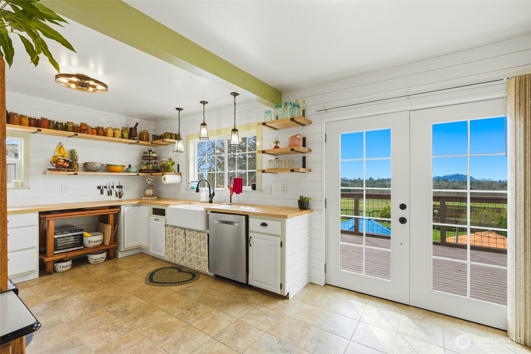 5334 Tenneson Road Sedro-Woolley, WA 98284 - Photo 7 of 39 a kitchen with white cabinets and sink