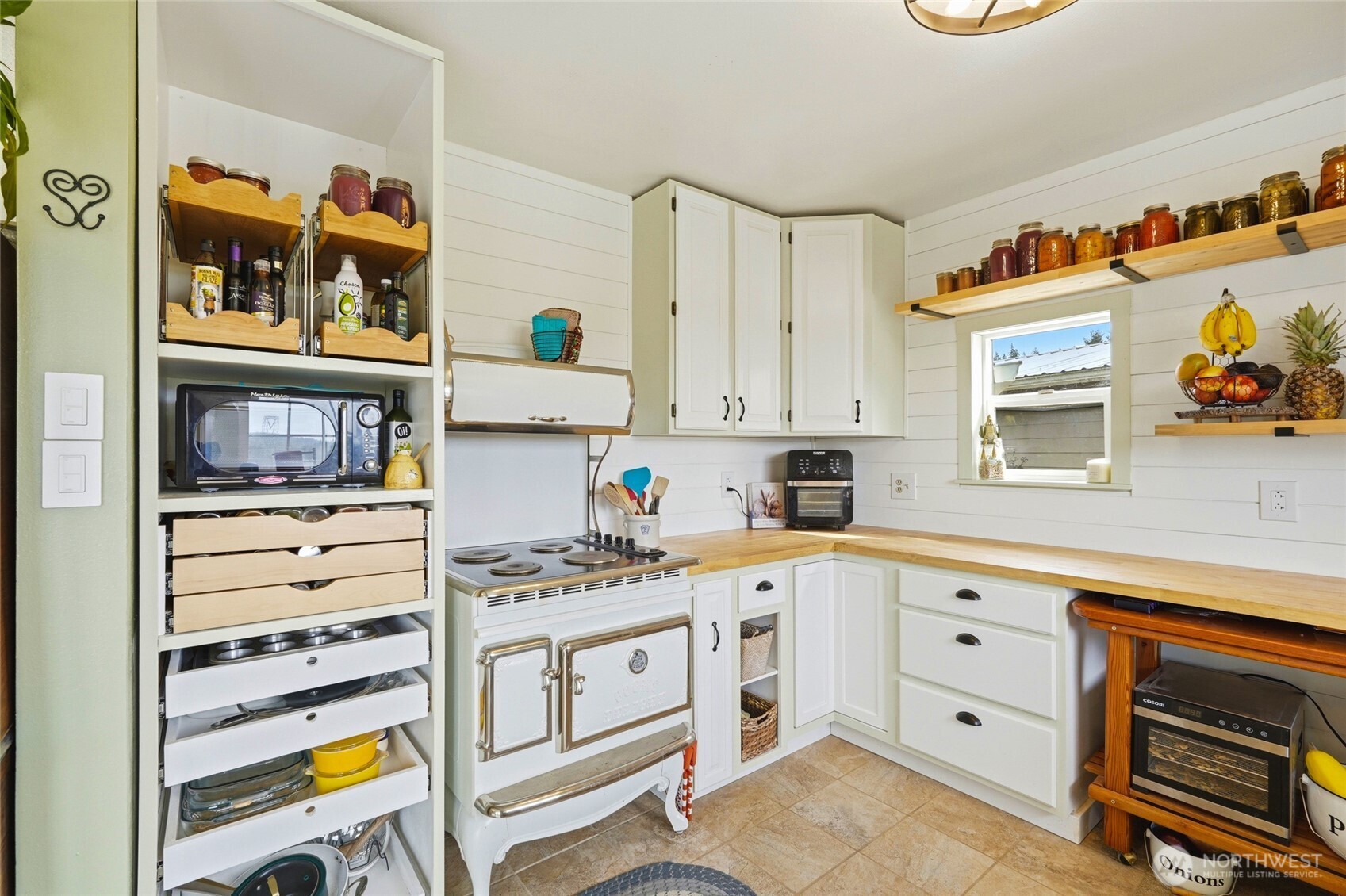 5334 Tenneson Road Sedro-Woolley, WA 98284 - Photo 10 of 39 a kitchen with stainless steel appliances cabinets and a window