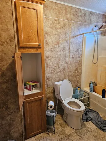 a bathroom with a toilet and a sink