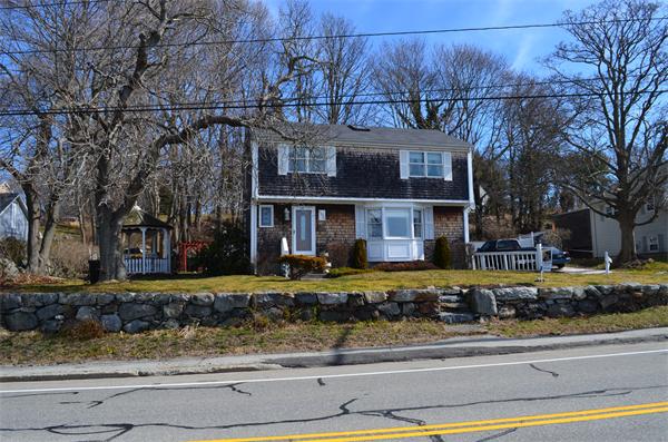 1938 Main Road Tiverton, RI 02878 - Photo 1 of 15 a view of a brick building next to a yard