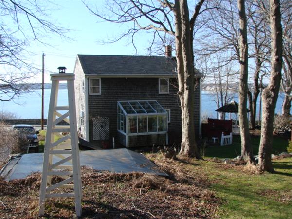 1938 Main Road Tiverton, RI 02878 - Photo 13 of 15 a front view of a house with garden