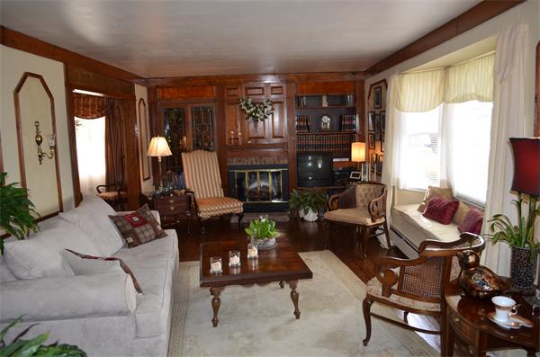 1938 Main Road Tiverton, RI 02878 - Photo 3 of 15 a living room with furniture fireplace and a large window