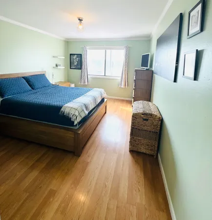 a bedroom with furniture and window