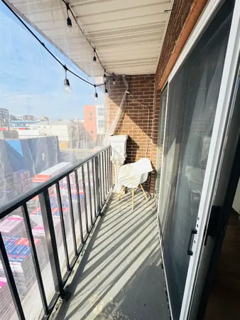 a utility room with dryer washer and a view of living room