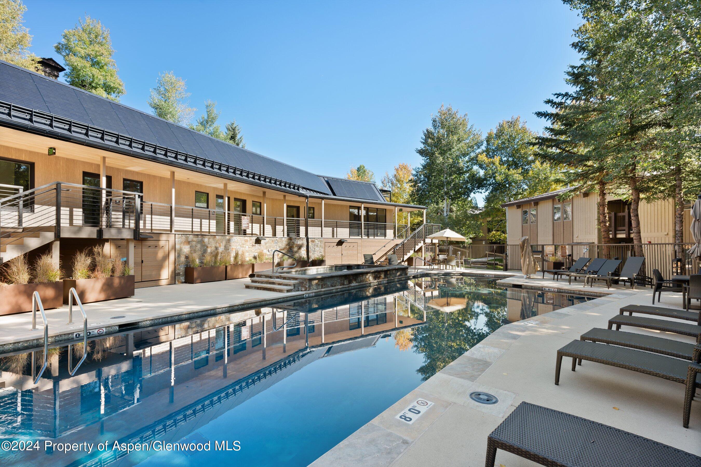 35 Upper Woodbridge Road, Unit 26EF Snowmass Village, CO 81615 - Photo 14 of 17 a view of a chairs and table in the balcony