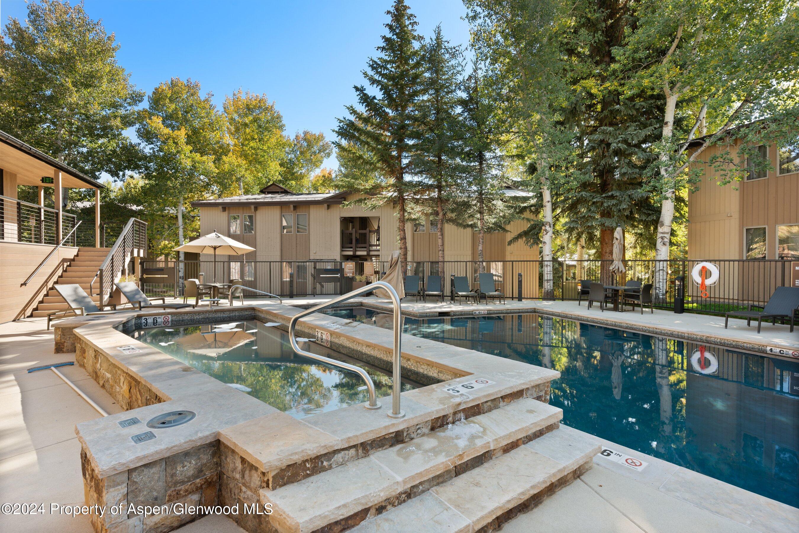 35 Upper Woodbridge Road, Unit 26EF Snowmass Village, CO 81615 - Photo 15 of 17 a view of a house with pool