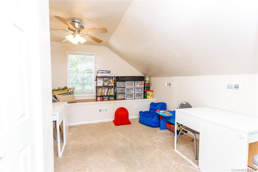 3114 Bush Road, Unit 19 Clover, SC 29710 - Photo 14 of 16 a bedroom with a bed and a chandelier