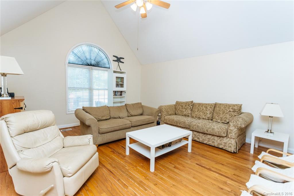 3114 Bush Road, Unit 19 Clover, SC 29710 - Photo 3 of 16 a living room with furniture a lamp and a chandelier