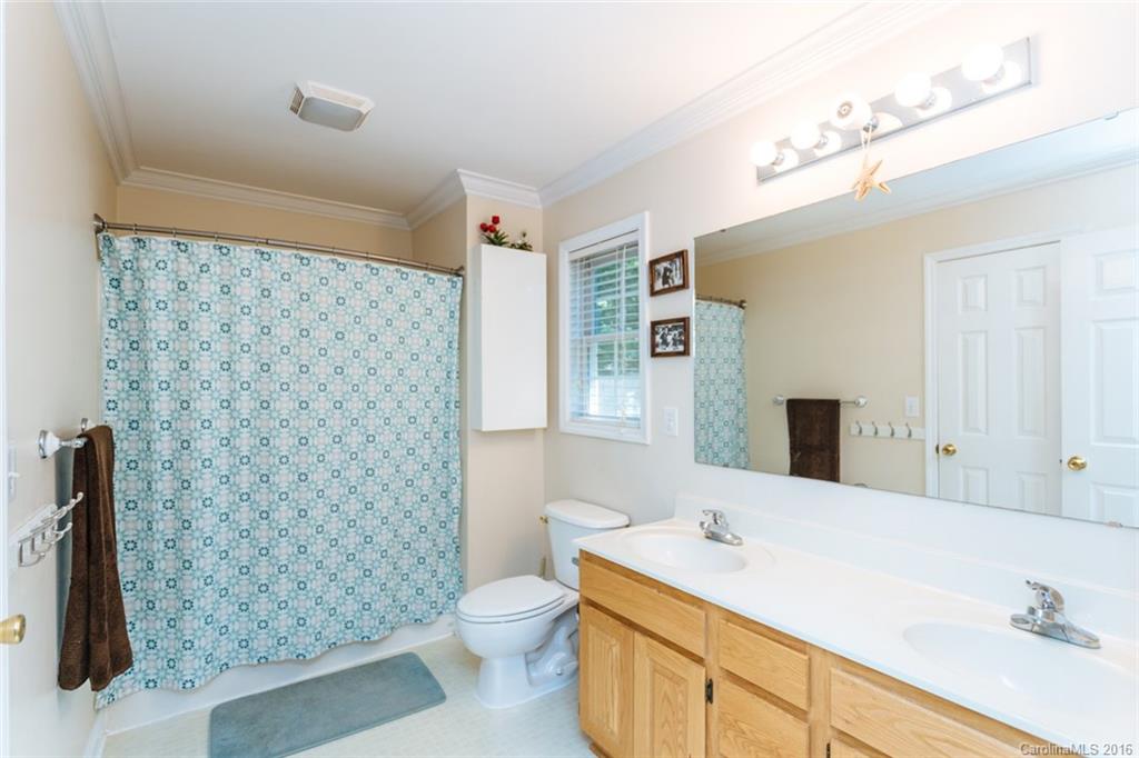 3114 Bush Road, Unit 19 Clover, SC 29710 - Photo 8 of 16 a bathroom with a sink a toilet and shower