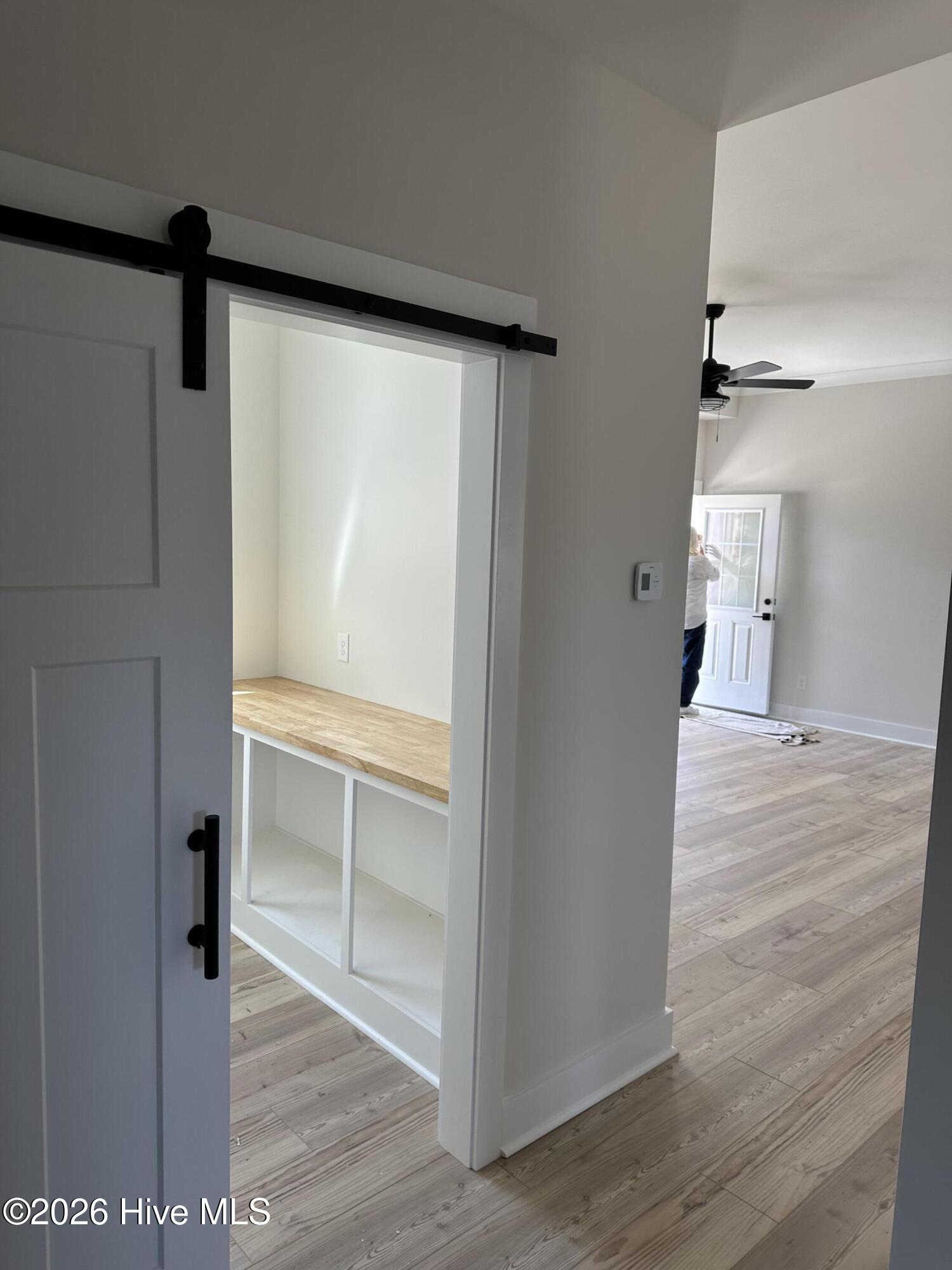 623 Winding Creek Road Rocky Point, NC 28457 - Photo 15 of 38 Barn door entering Large Pantry