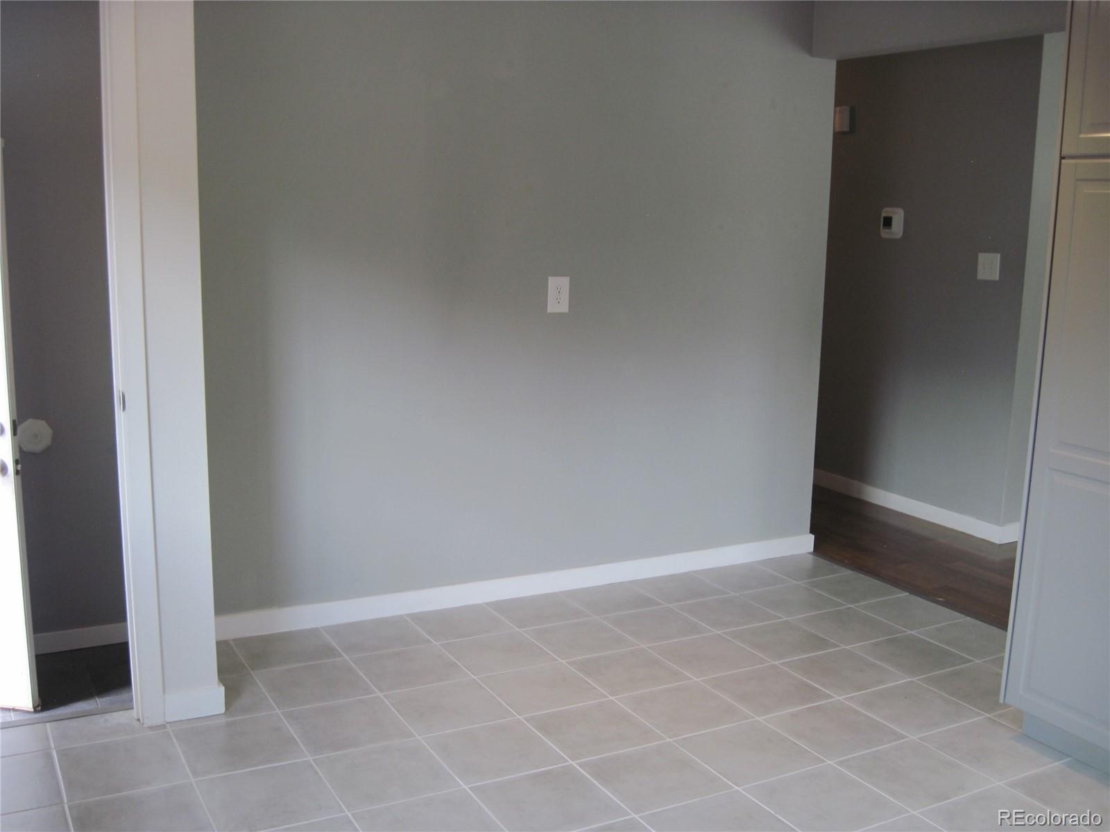 1014 Alexander Road Colorado Springs, CO 80909 - Photo 14 of 44 an empty room and a window