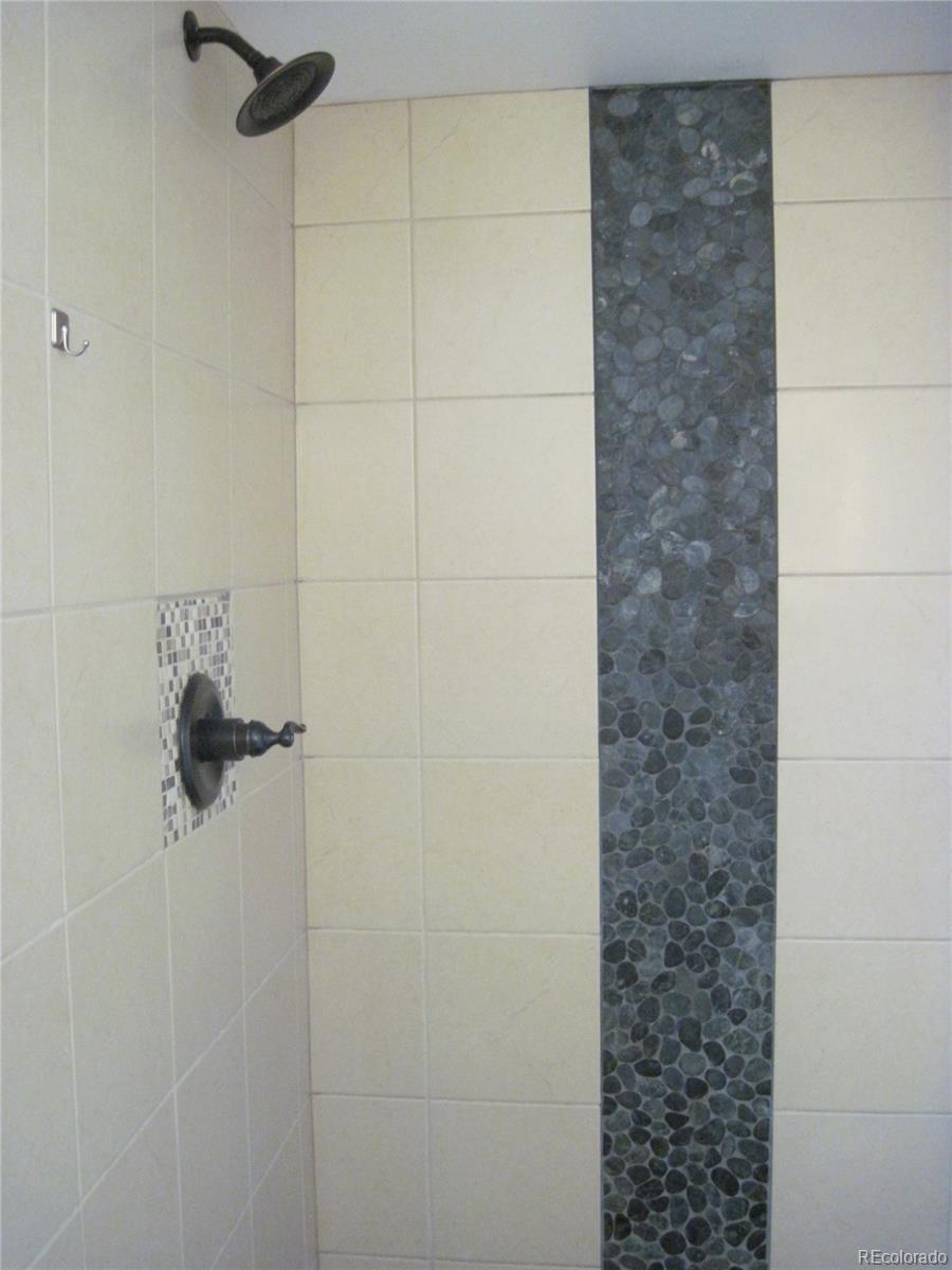 1014 Alexander Road Colorado Springs, CO 80909 - Photo 28 of 44 a bathroom with a shower