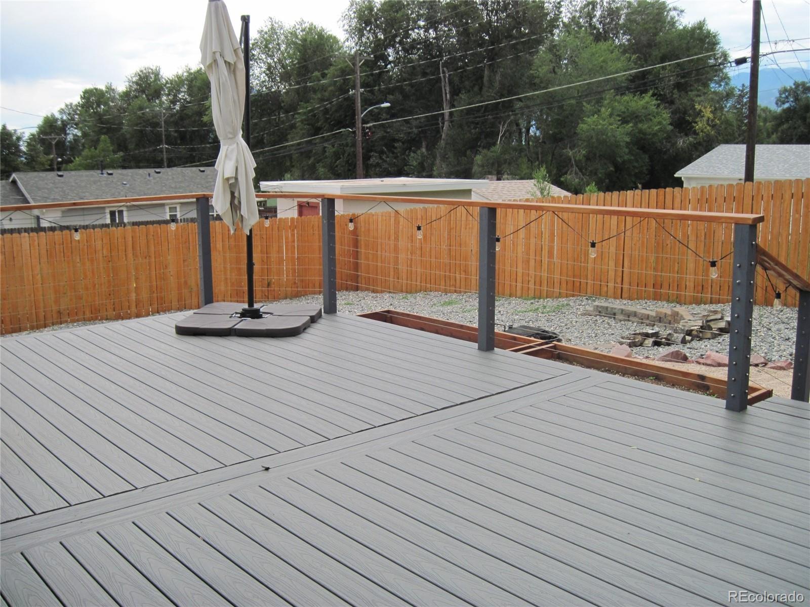 1014 Alexander Road Colorado Springs, CO 80909 - Photo 33 of 44 a view of a wooden floor with a bench