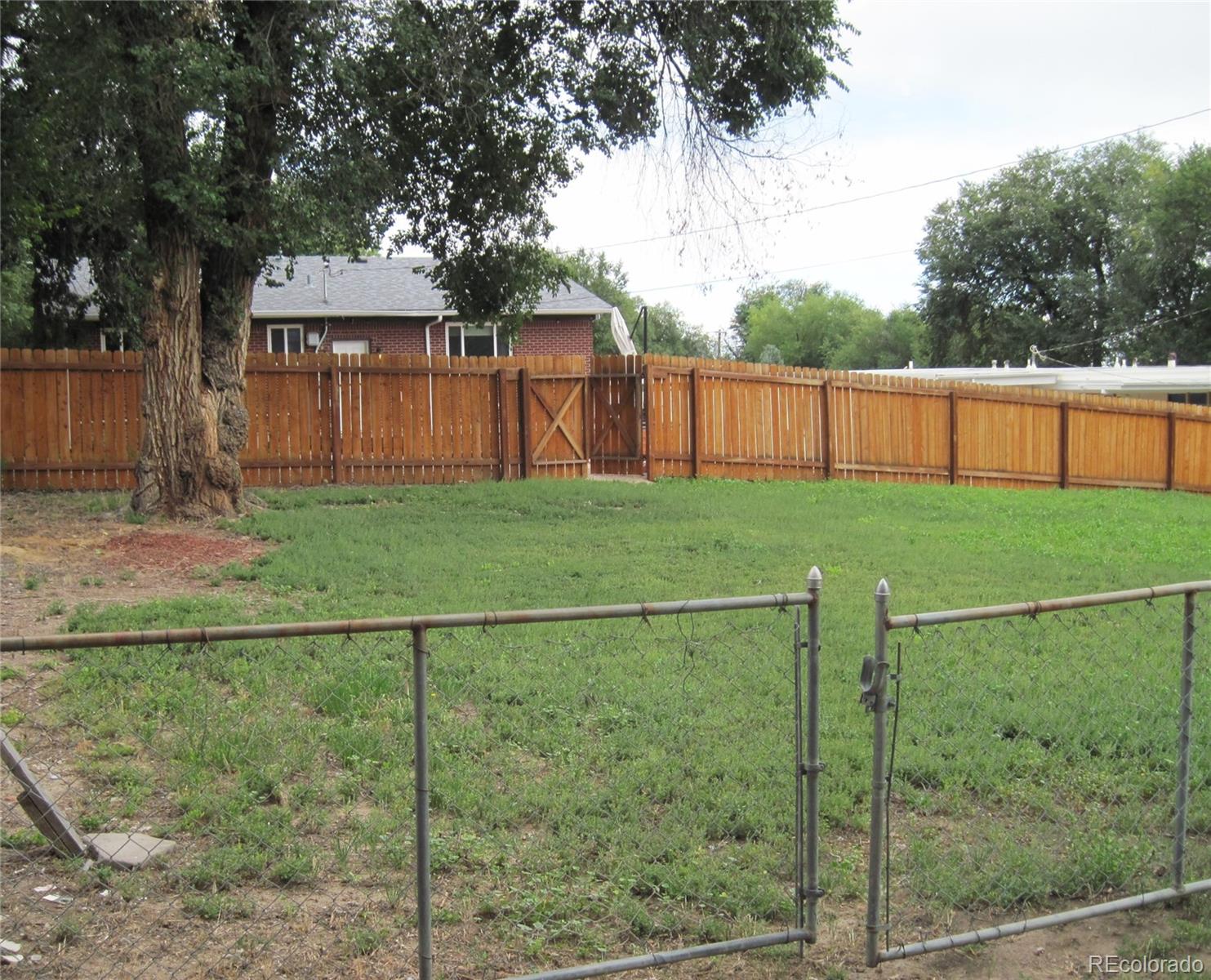 1014 Alexander Road Colorado Springs, CO 80909 - Photo 40 of 44 a view of a backyard