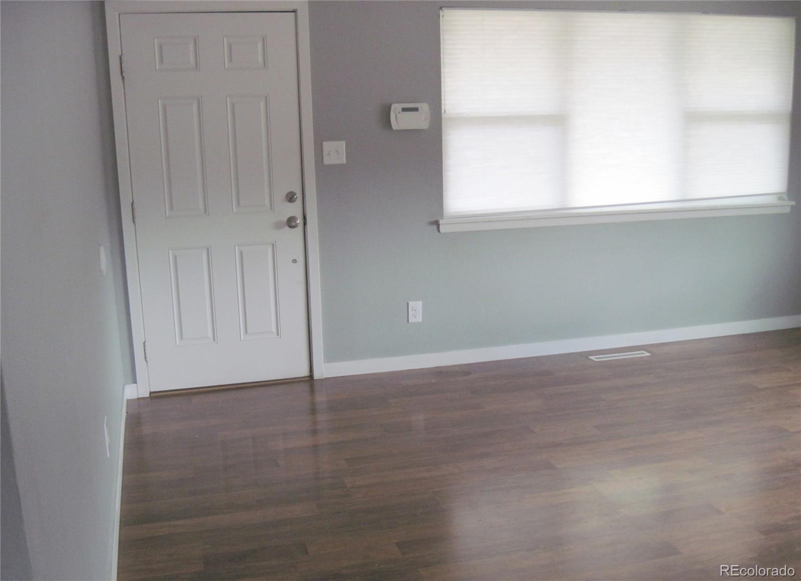 1014 Alexander Road Colorado Springs, CO 80909 - Photo 5 of 44 an empty room with window