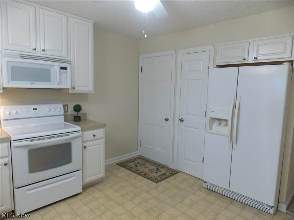 6299 South Canterbury Road Parma, OH 44129 - Photo 10 of 26 Built in microwave and lots of cabinets for all of your storage needs. Pantry for additional storage.