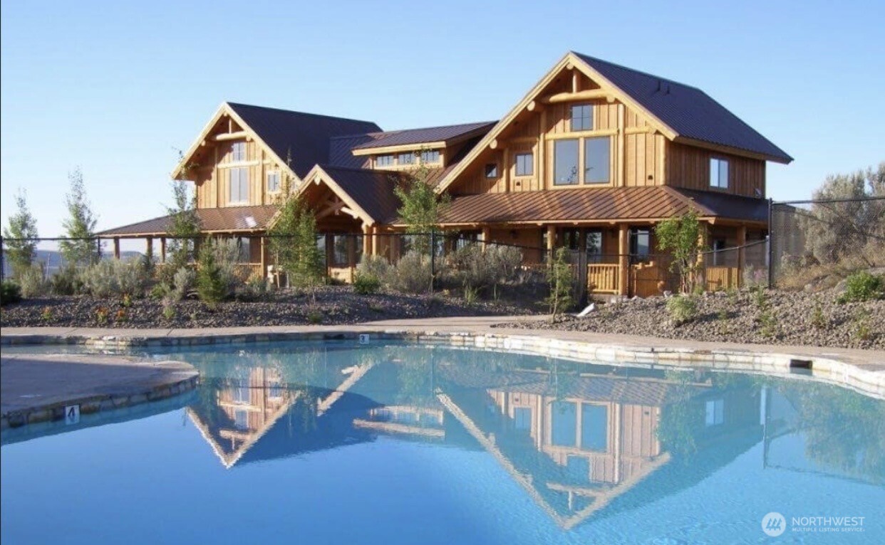 215 Plata Road Brewster, WA 98812 - Photo 28 of 40 a front view of a house with swimming pool