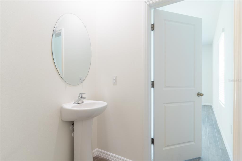 4807 Southwest 51st Terrace Gainesville, FL 32608 - Photo 14 of 35 a bathroom with a sink a mirror and a shower