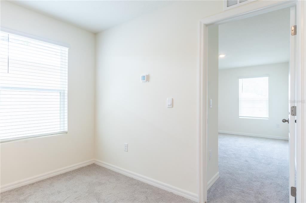4807 Southwest 51st Terrace Gainesville, FL 32608 - Photo 16 of 35 a view of an empty room with a window