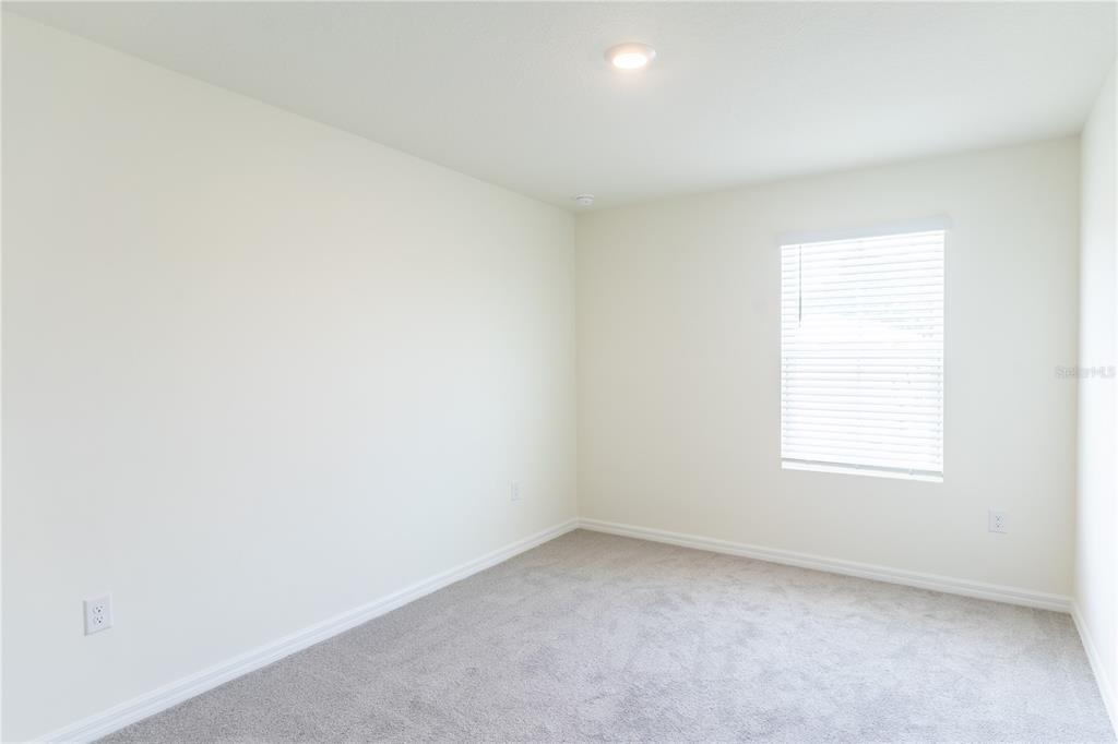 4807 Southwest 51st Terrace Gainesville, FL 32608 - Photo 18 of 35 an empty room with a window