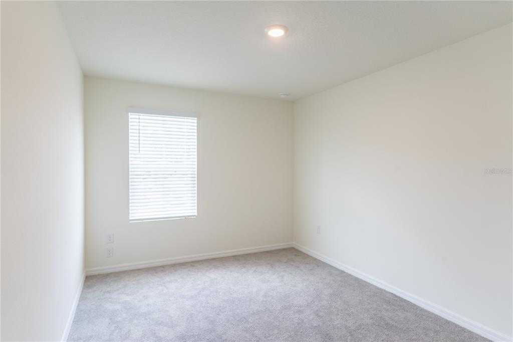 4807 Southwest 51st Terrace Gainesville, FL 32608 - Photo 20 of 35 an empty room with a window