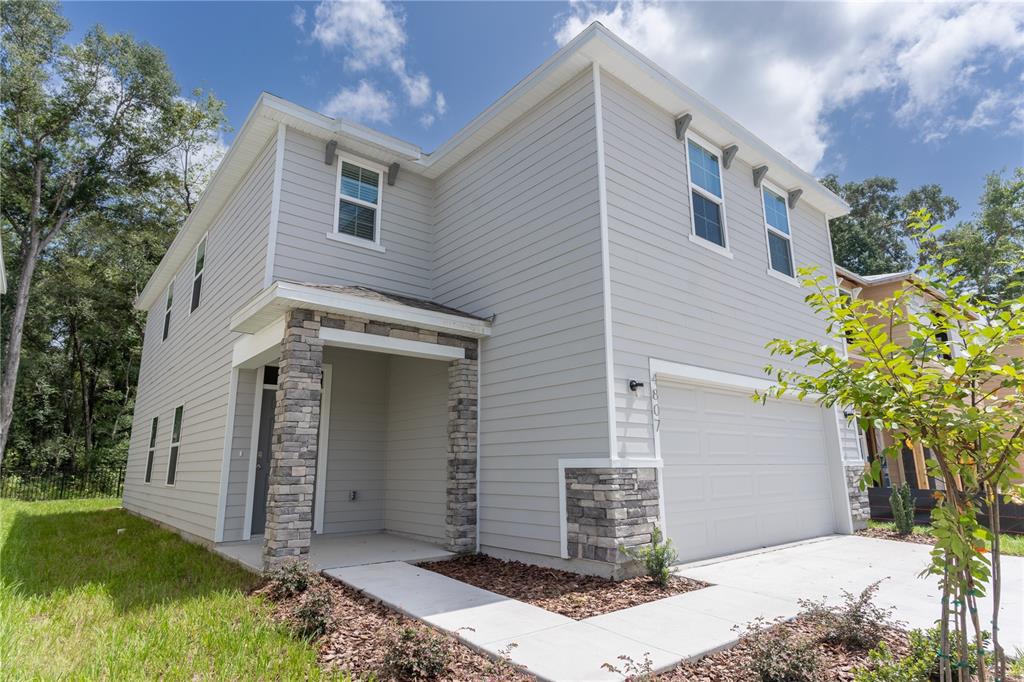 4807 Southwest 51st Terrace Gainesville, FL 32608 - Photo 2 of 35 a front view of a house with garden