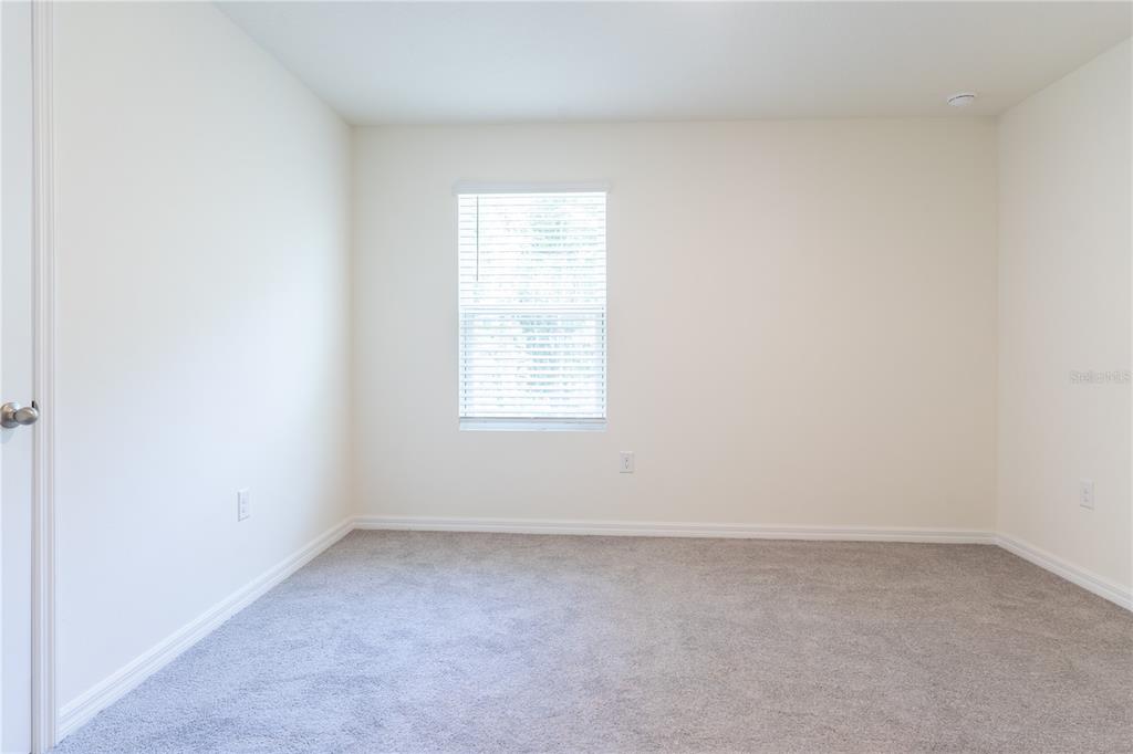 4807 Southwest 51st Terrace Gainesville, FL 32608 - Photo 32 of 35 an empty room with a window