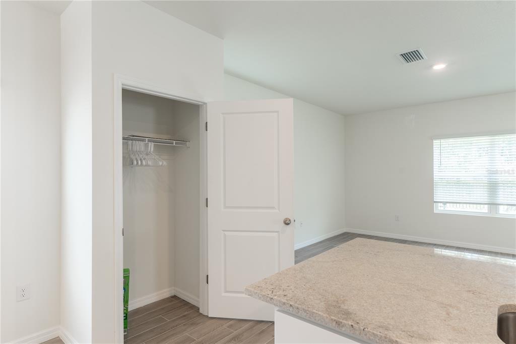 4807 Southwest 51st Terrace Gainesville, FL 32608 - Photo 7 of 35 a view of empty room with window and wooden floor
