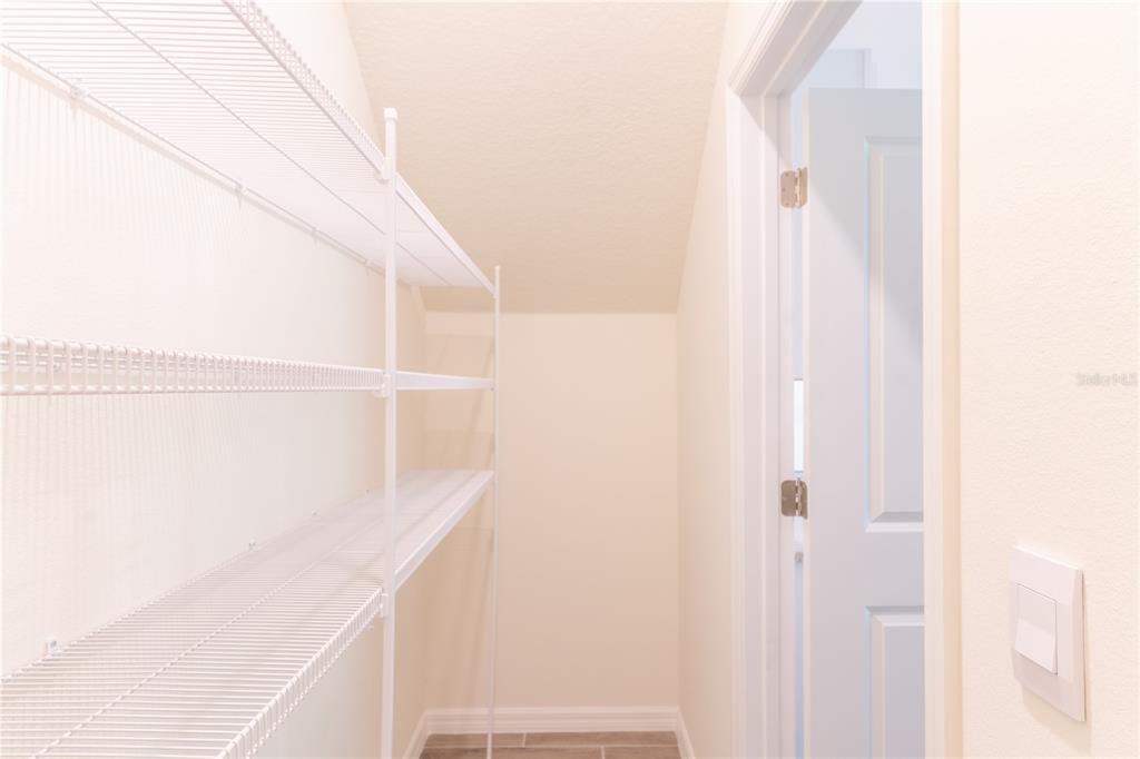 4807 Southwest 51st Terrace Gainesville, FL 32608 - Photo 9 of 35 a view of staircase with white walls and white door