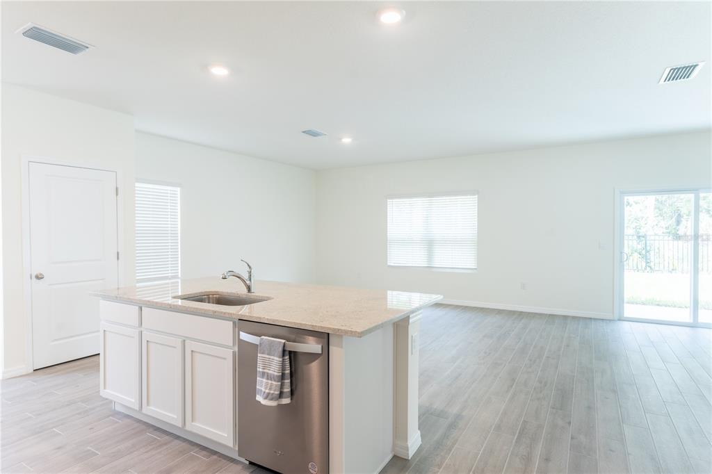 4807 Southwest 51st Terrace Gainesville, FL 32608 - Photo 10 of 35 a utility room with faucet washer and dryer