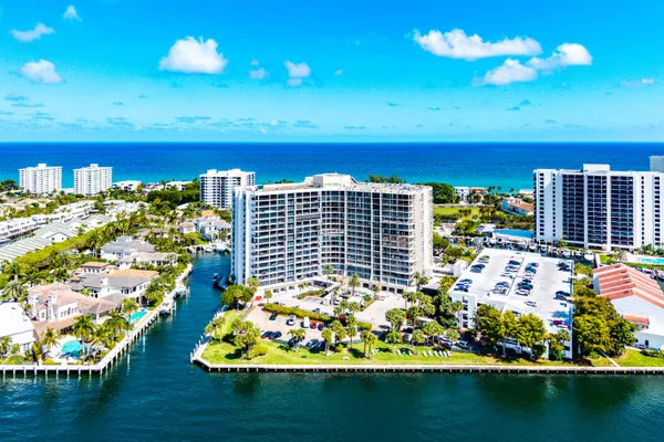 a view of a balcony with chairs and a table