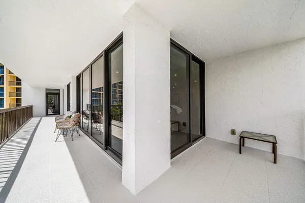 a view of a hallway with living room and furniture