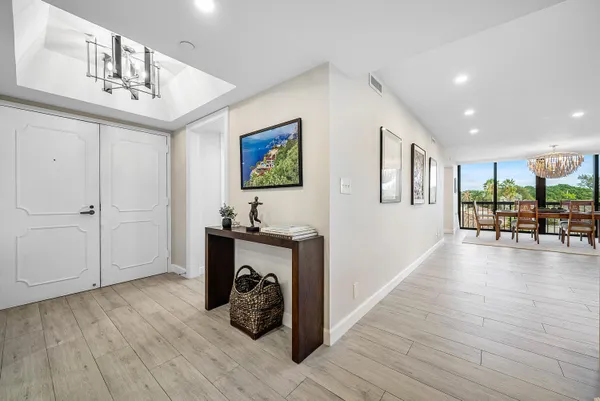 a view of a livingroom with furniture hardwood floor and staircase