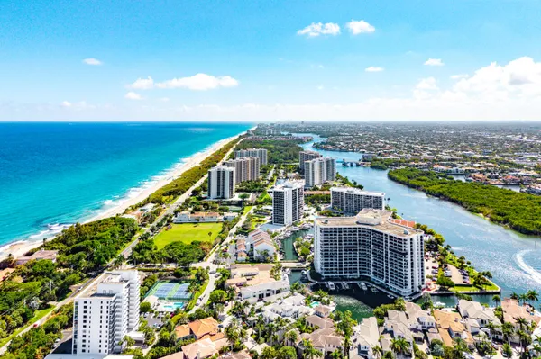 a view of sign board with flower around