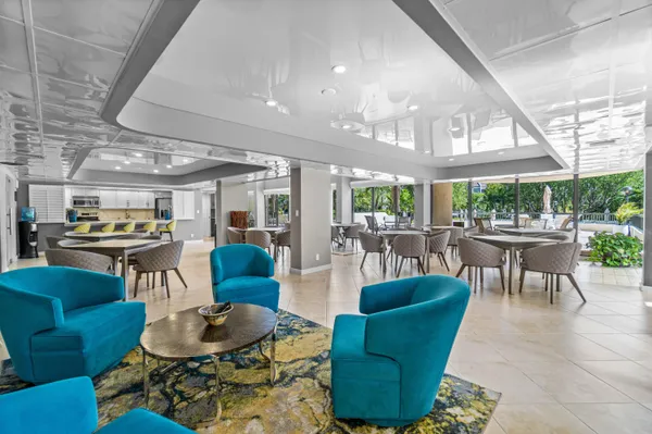 a view of a chairs and table in a room