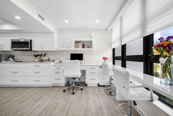 a living room with furniture and flat screen tv