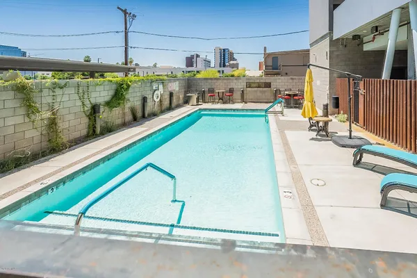 a view of a swimming pool and outdoor kitchen