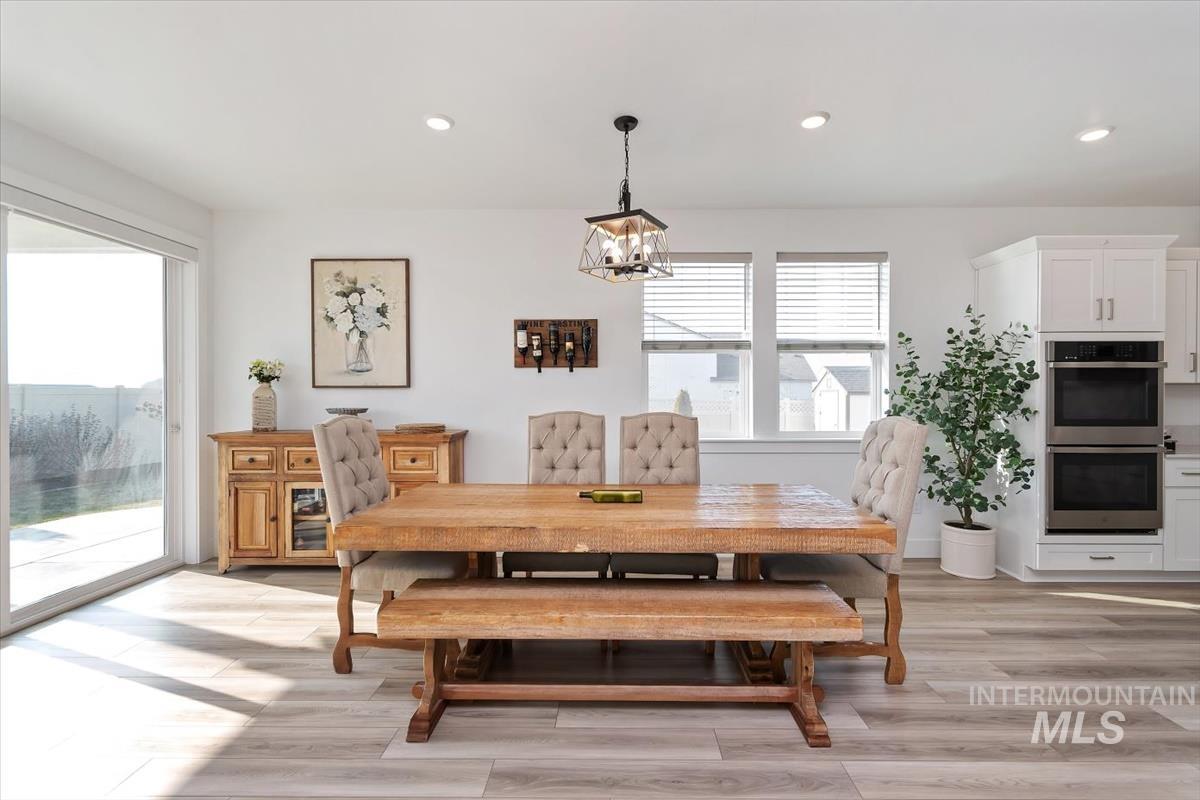 14361 Fractus Drive Caldwell, ID 83607 - Photo 12 of 50 Dining space with recessed lighting, light wood-style flooring, and a chandelier