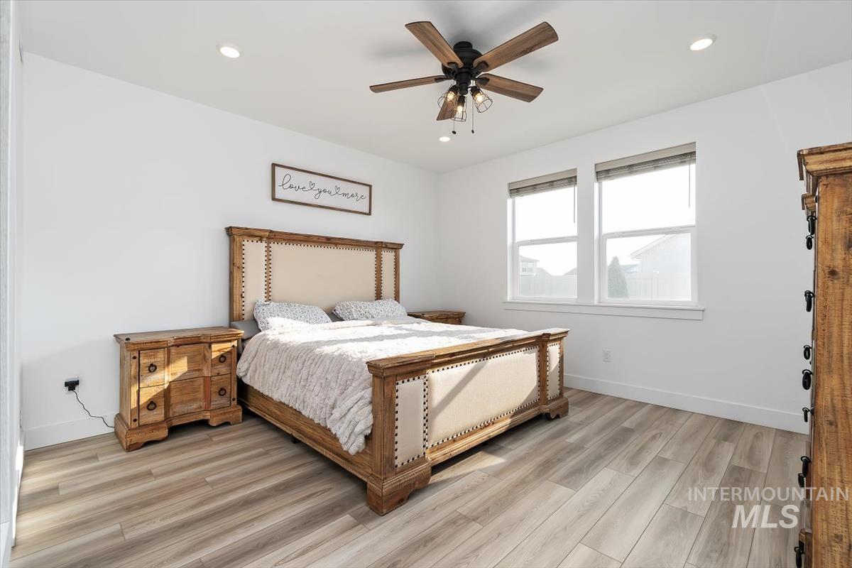 14361 Fractus Drive Caldwell, ID 83607 - Photo 15 of 50 Bedroom featuring ceiling fan, light wood finished floors, and recessed lighting